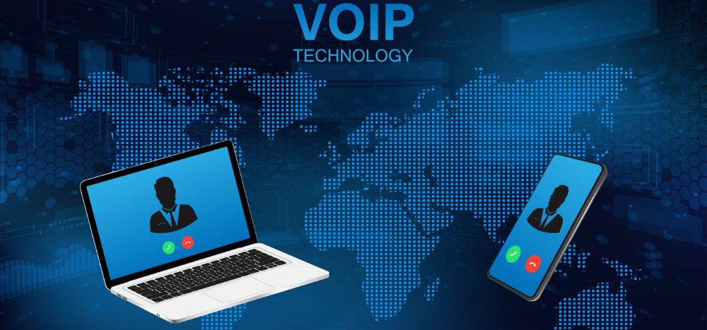 VoIP vs Landline Which is Better for a UK Business: A dark blue digital illustration reading "VoIP Technology" above a world map made of dots, with a laptop and a smartphone each showing an incoming call screen with green and red call icons.